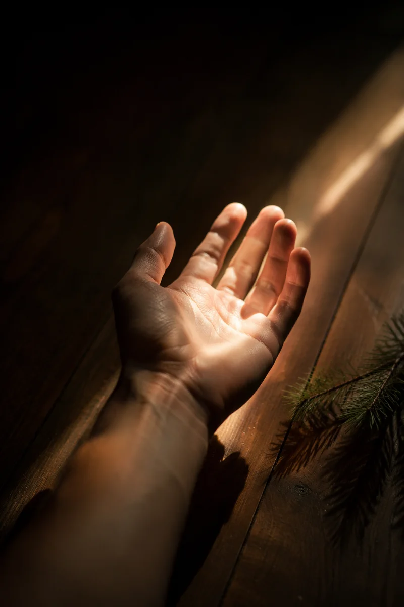 Open Hand Reaching Toward Divine Light
