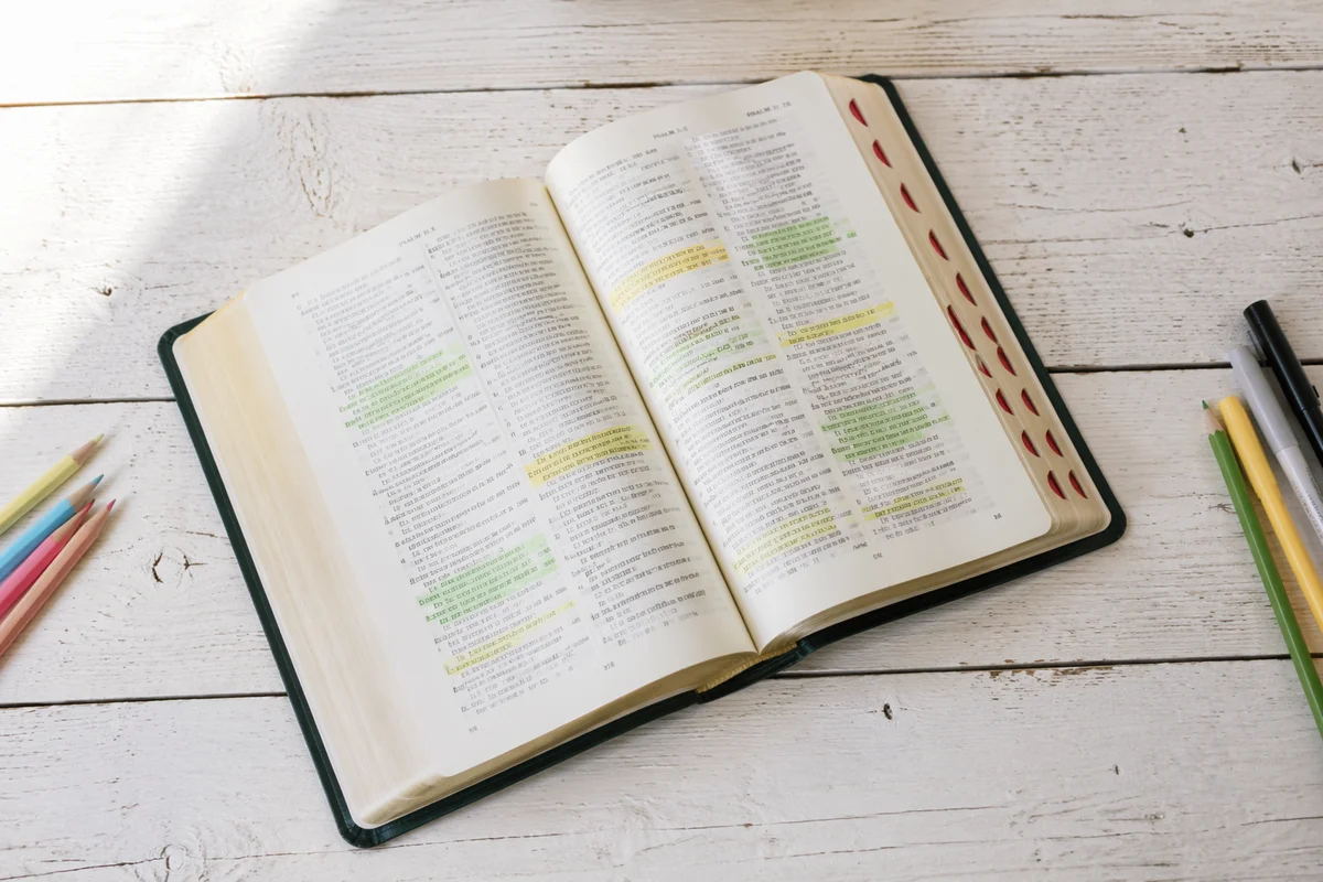 Highlighted Bible Passages on Wooden Table