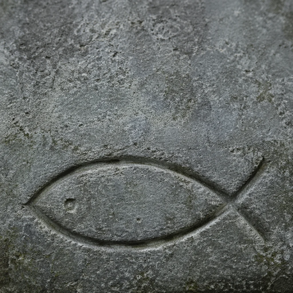 Carved Ichthys Symbol on Weathered Stone