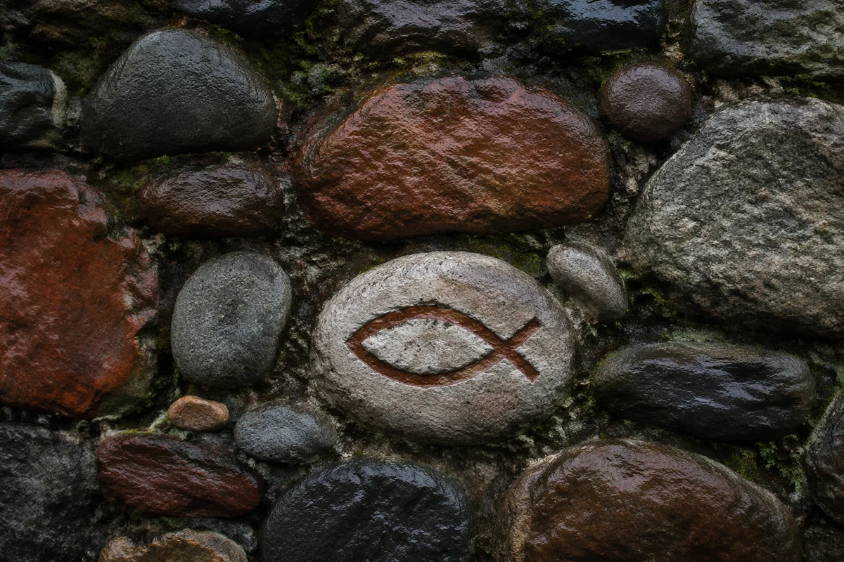 Carved Ichthys Symbol on Rain Wet Stone