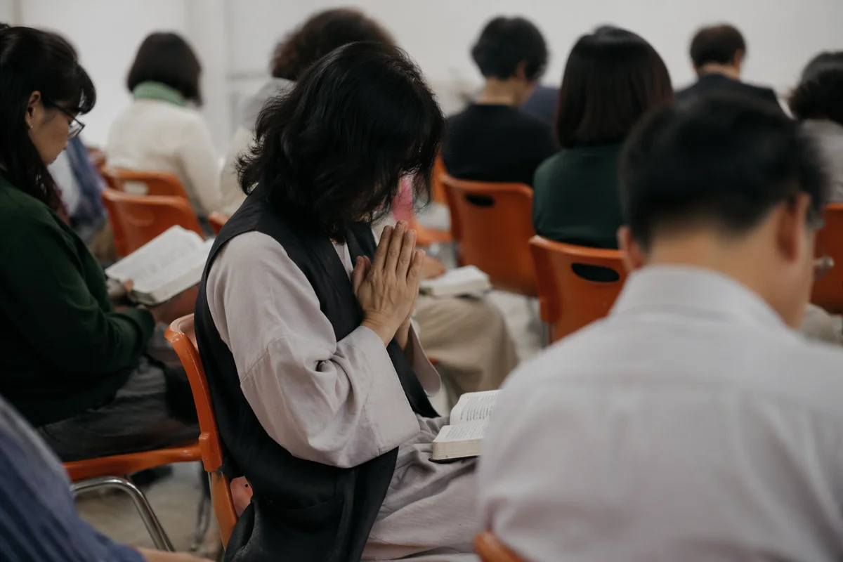 Quiet Intercessory Prayer Circle in Community Hall