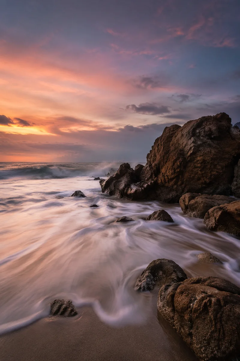 Sunrise Waves Over Steadfast Rocky Shore