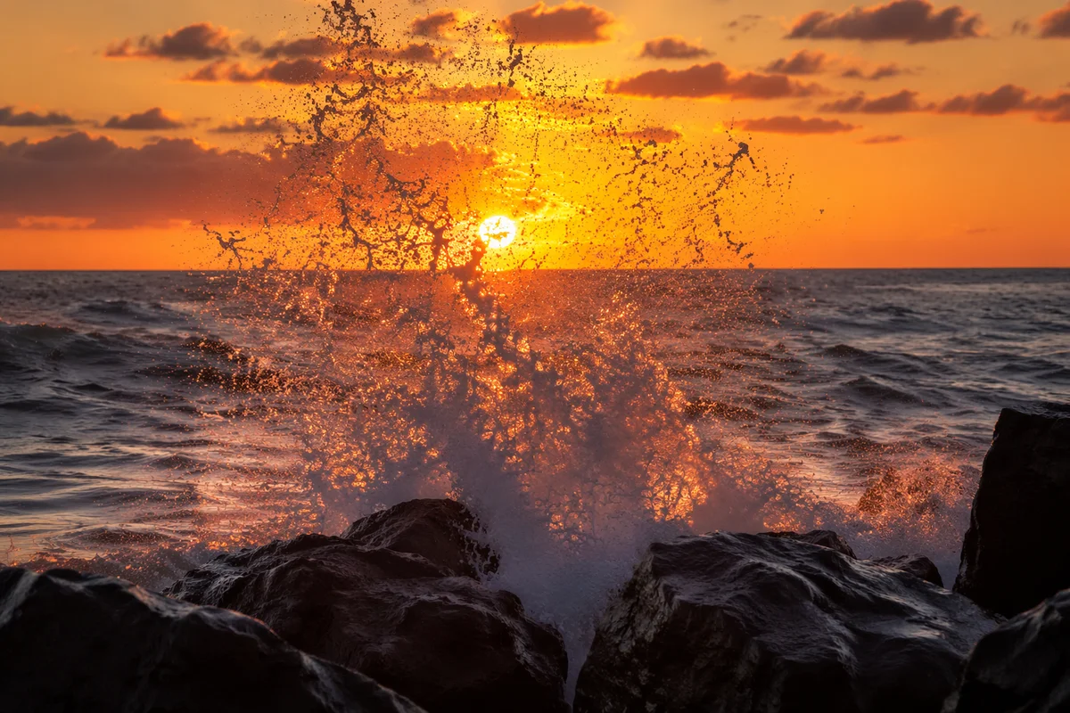 Sunrise Waves Crashing on Coastal Rocks