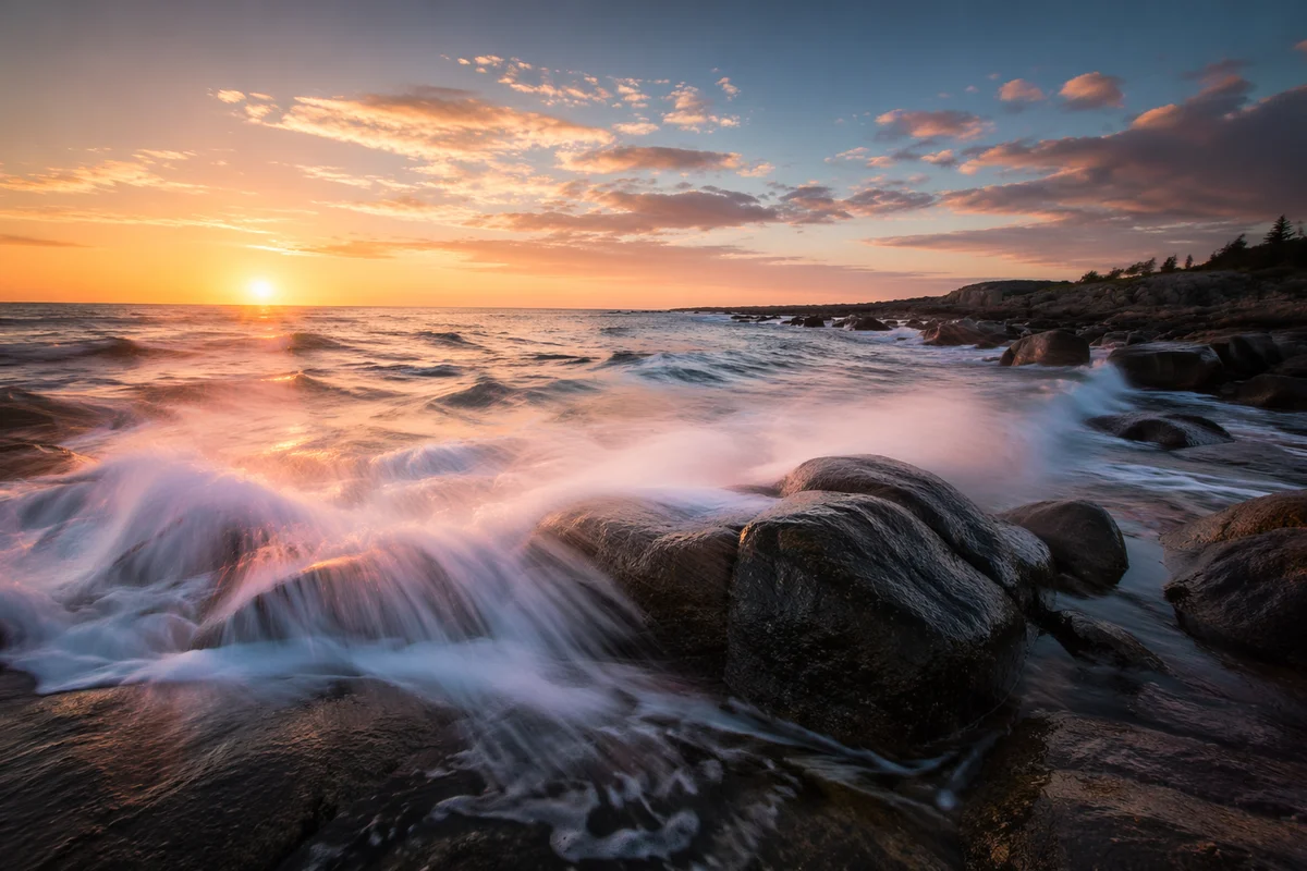 Sunrise Waves Crashing Over Coastal Rocks