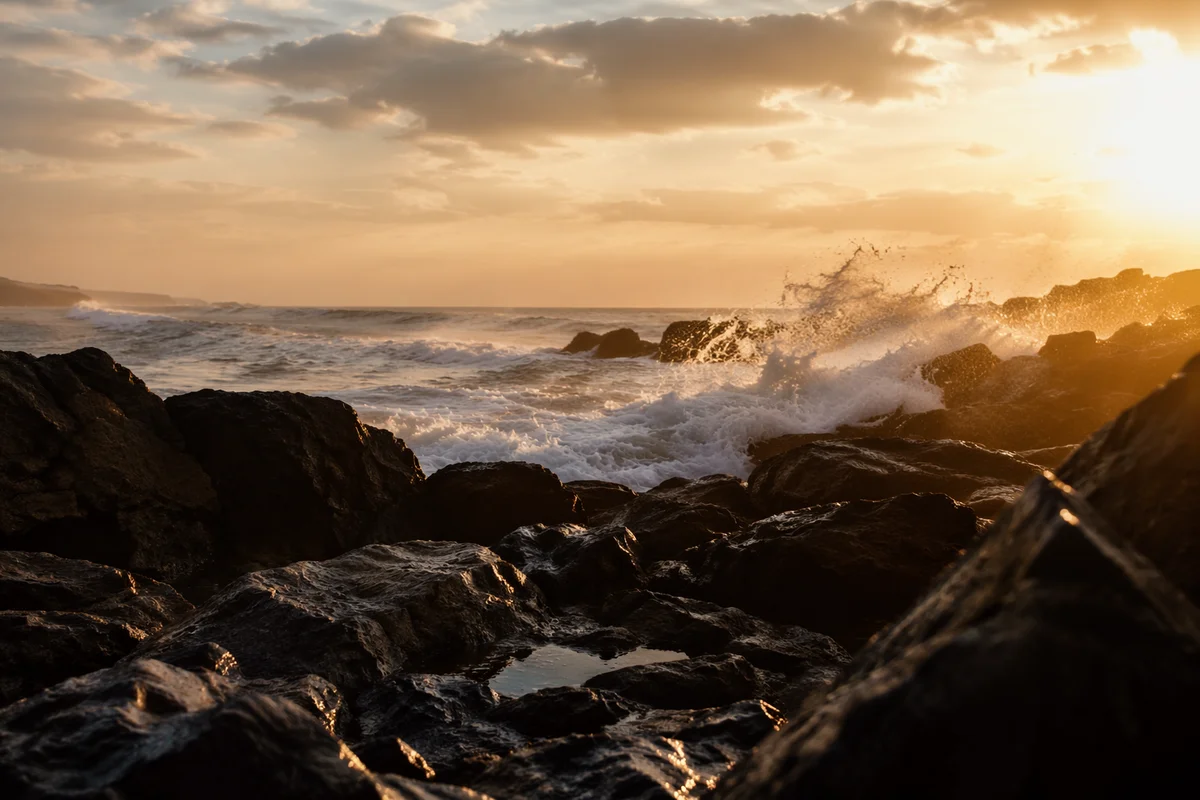 Sunrise Waves Crashing Over Volcanic Rocks