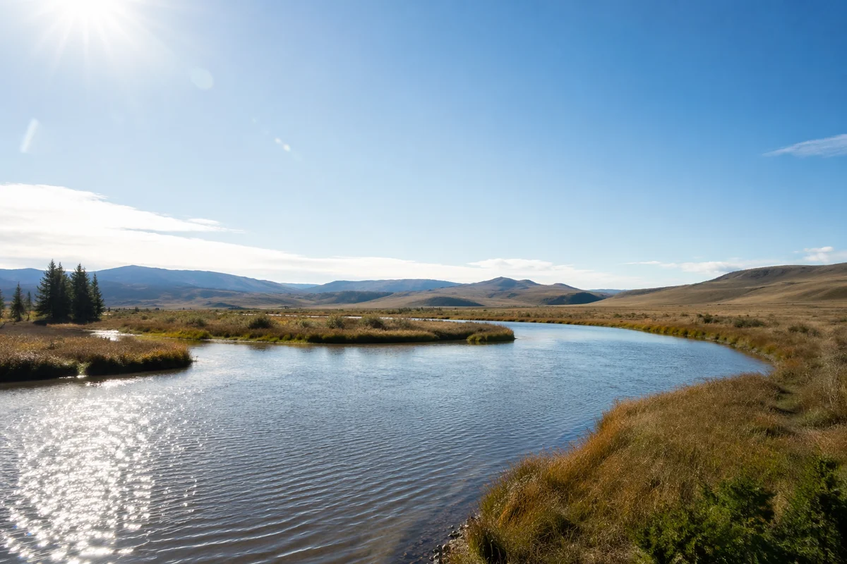 Peaceful River Valley Under Clear Blue Sky