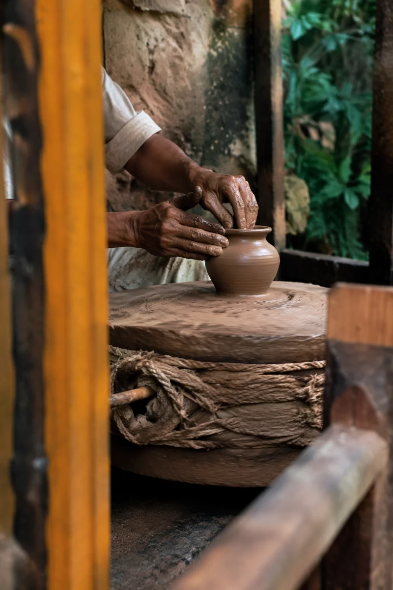 Potter Hands Shaping Clay Vessel
