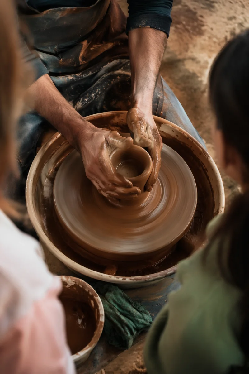 Potter Hands Shaping Clay Vessel