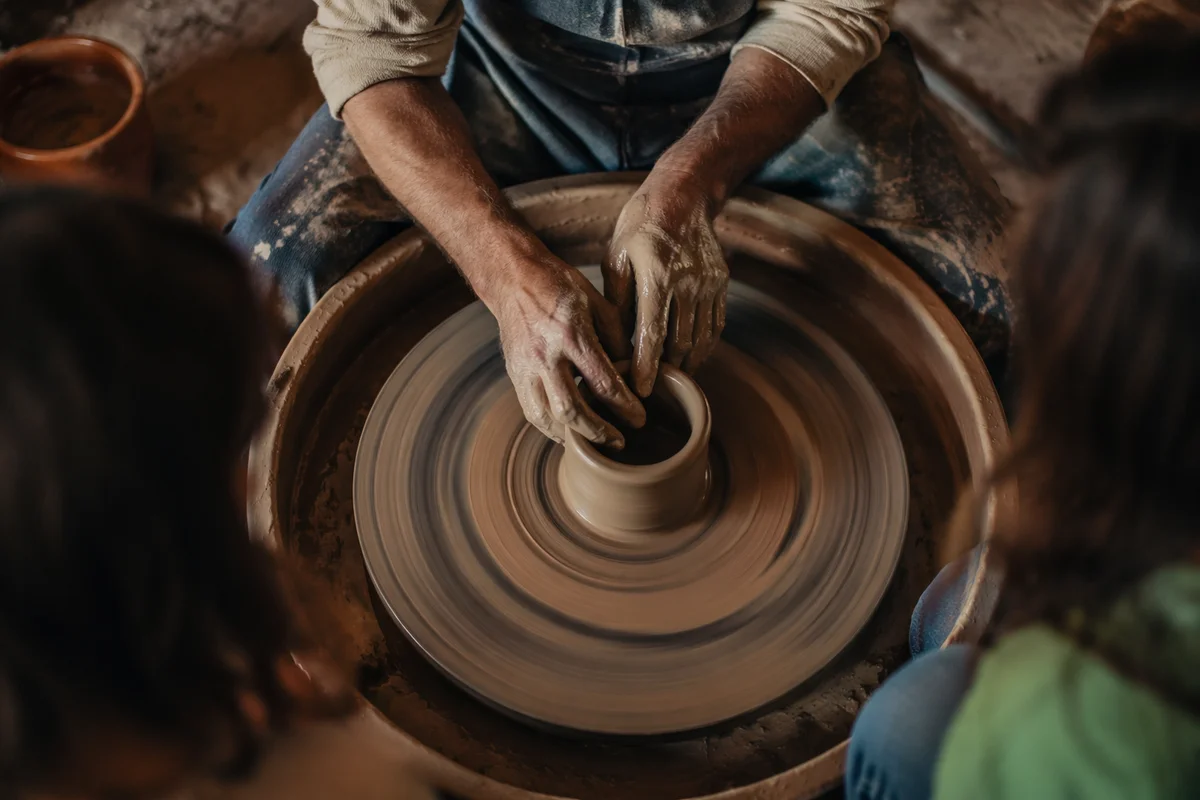 Potter Hands Shaping Clay on Wheel