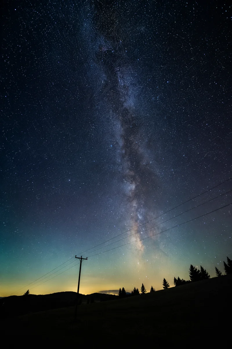 Milky Way Over Evergreen Rural Hillside