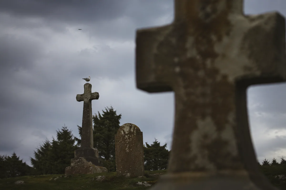 Weathered Stone Cross in Evergreen Cemetery