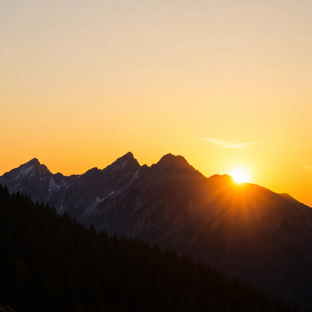 Golden Sunrise Over Evergreen Mountain Range