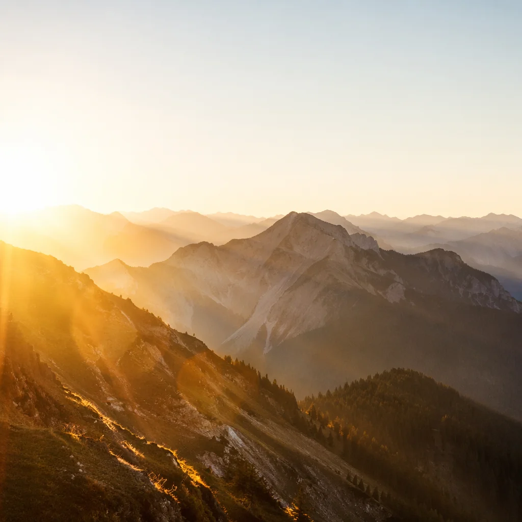 Golden Sunrise Over Evergreen Mountain Range