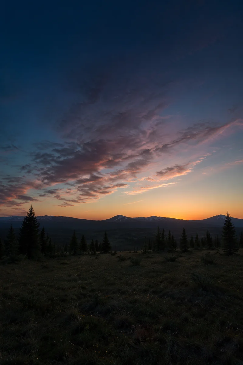 Golden Dawn Over Evergreen Mountain Highlands
