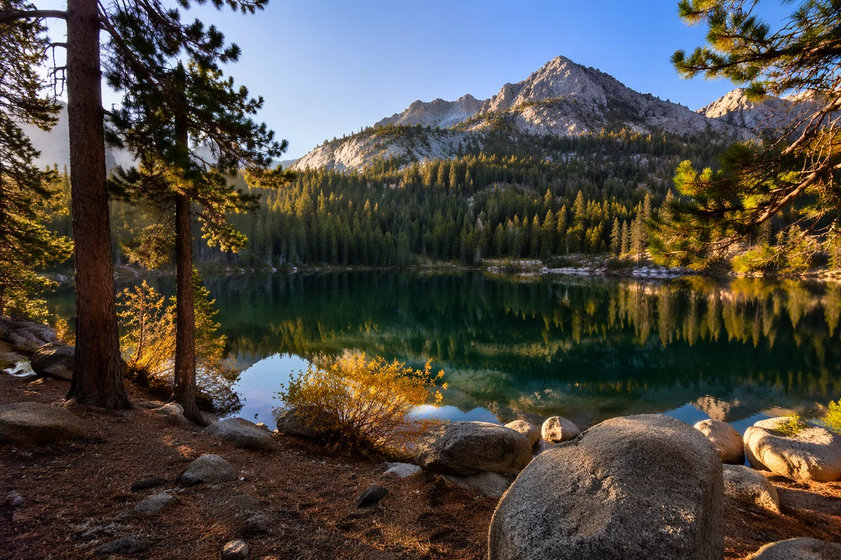 Golden Sunrise Over Evergreen Mountain Lake