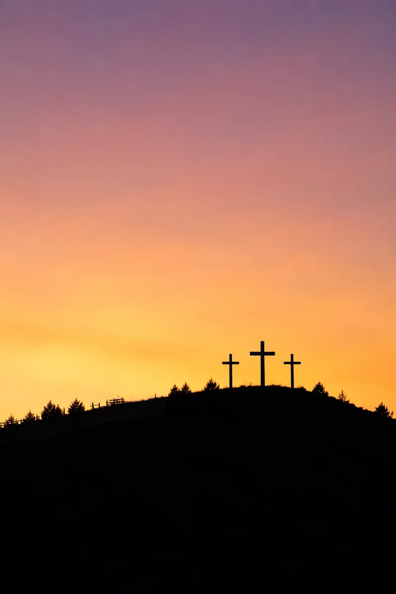 Three Crosses on Hill at Sunset