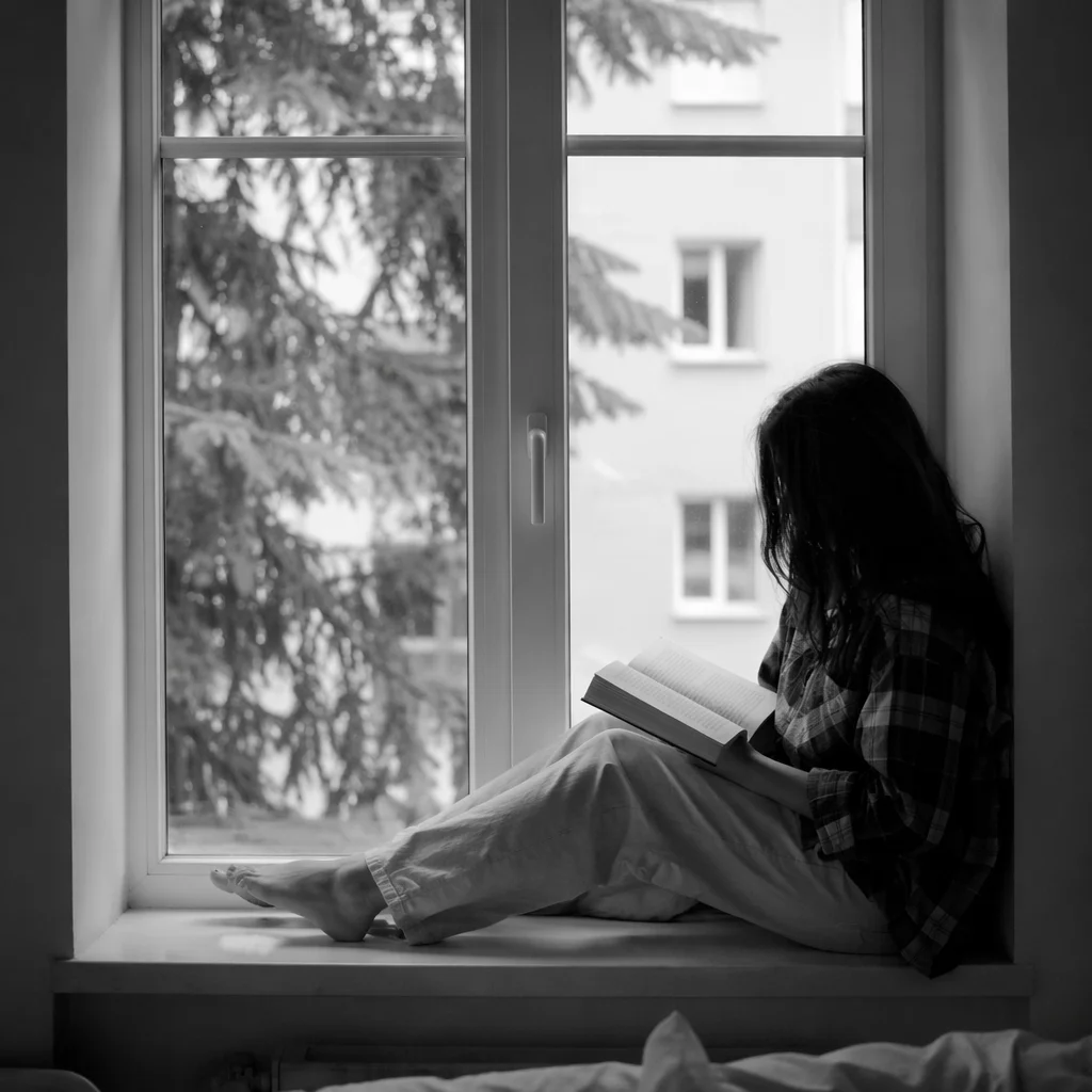 Woman Reading Bible Beside Window