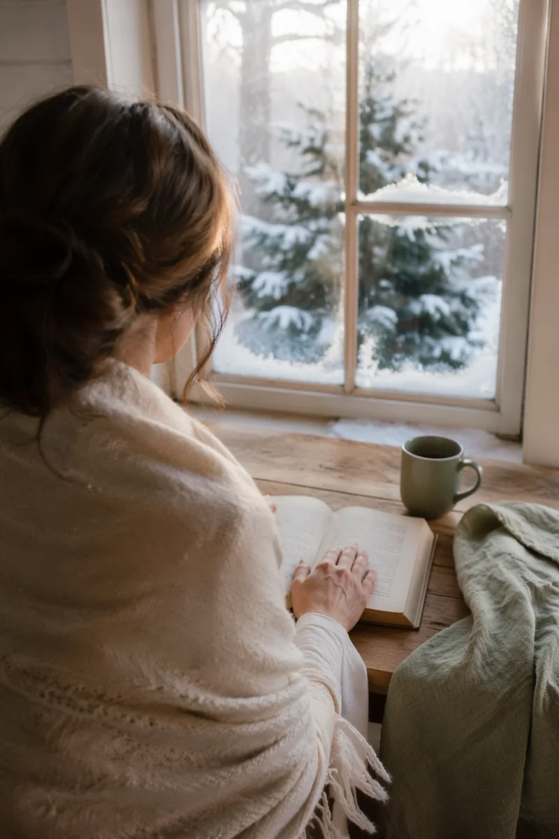 Quiet Morning Bible Reading by Frosted Window