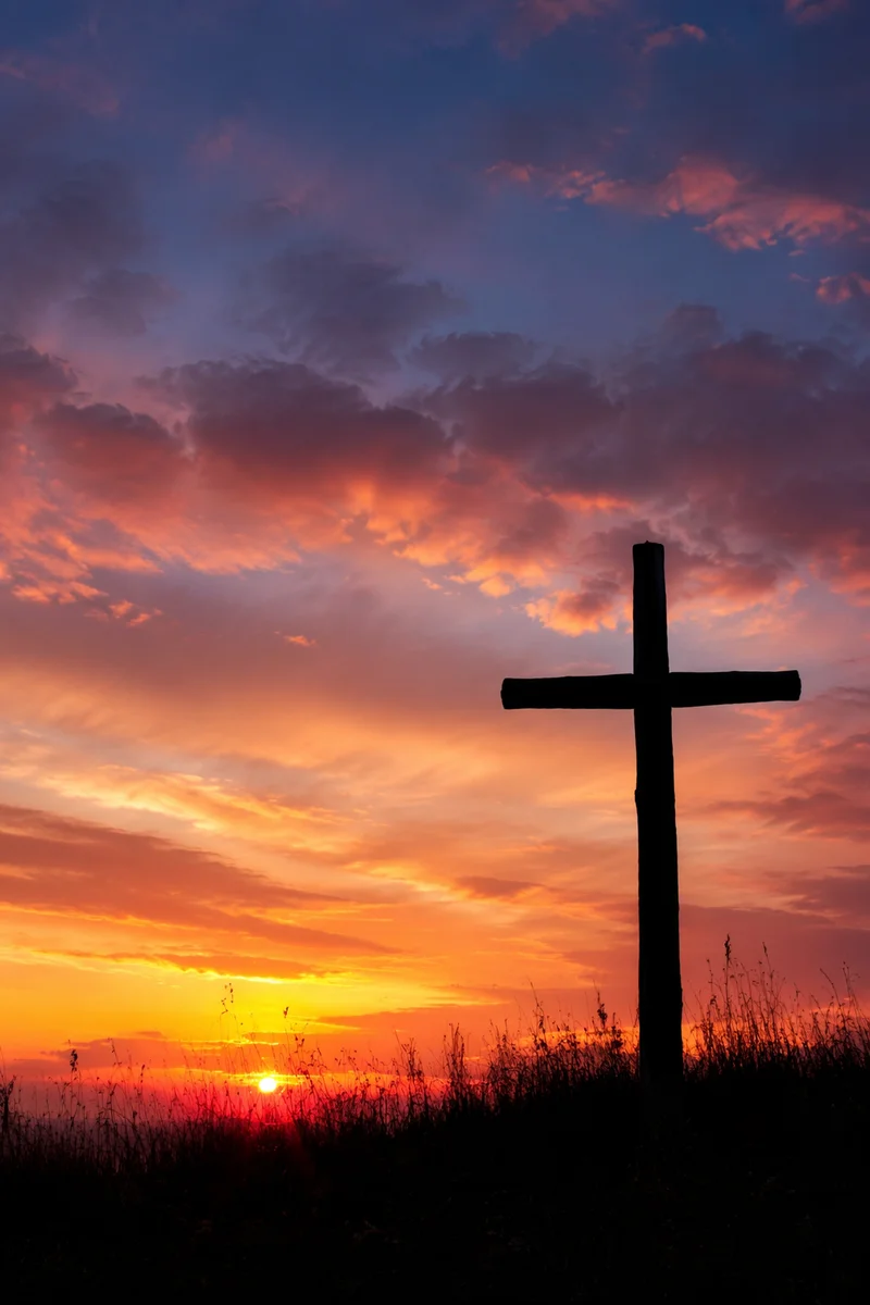 Wooden Cross Silhouette at Peaceful Sunrise