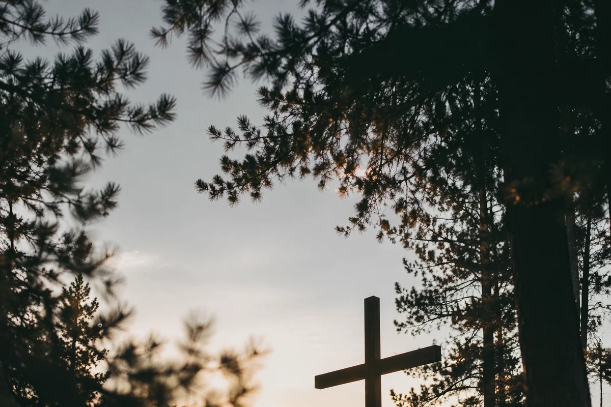 Wooden Cross at Evergreen Sunrise