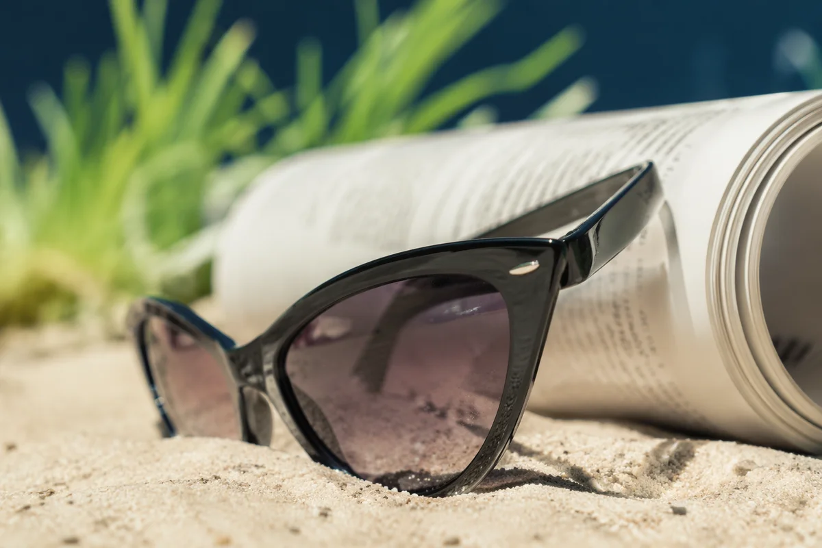 Black Cat Eye Sunglasses on Beach Sand