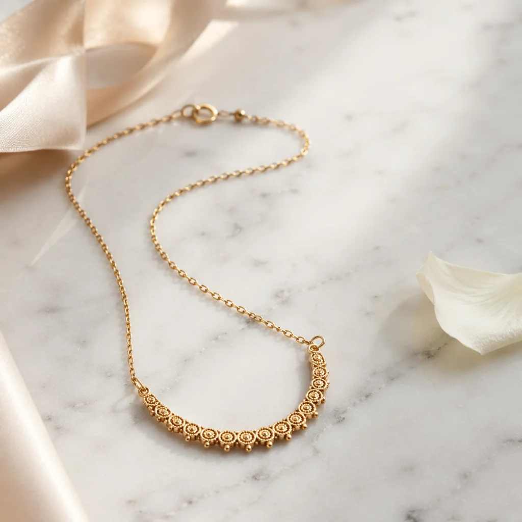 Elegant Gold Necklace on White Marble