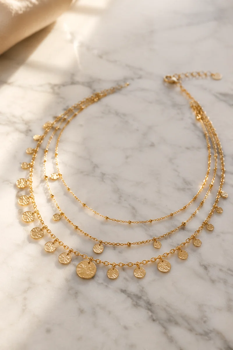 Elegant Gold Necklace on White Marble