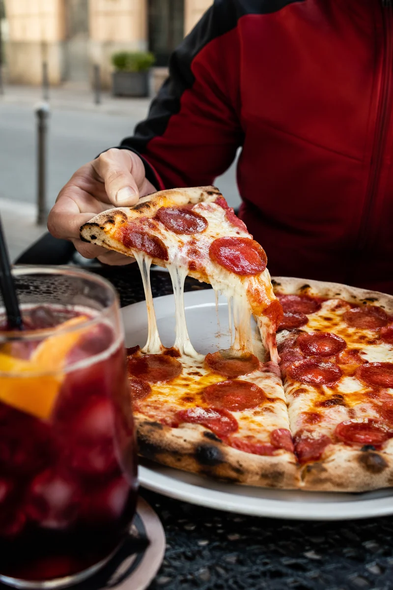Fresh Pepperoni Pizza Slice at Outdoor Cafe