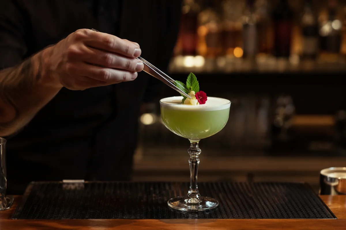Herbal Garnished Pale Green Craft Cocktail