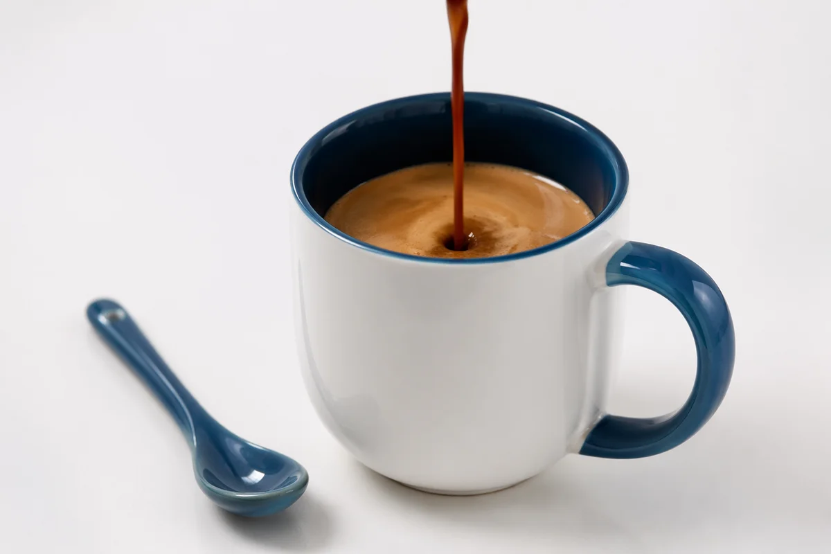 Minimalist Espresso Pour Into Blue White Mug