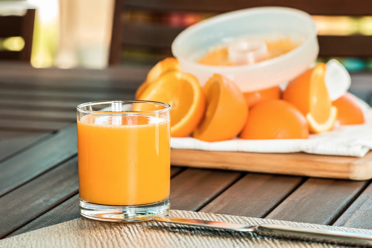Freshly Squeezed Orange Juice on Rustic Table