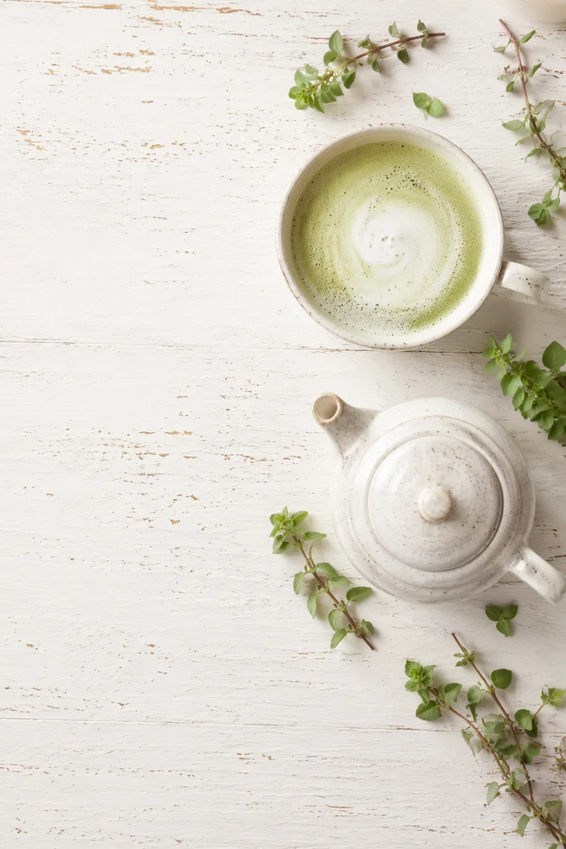 Overhead Matcha Latte with White Teapot