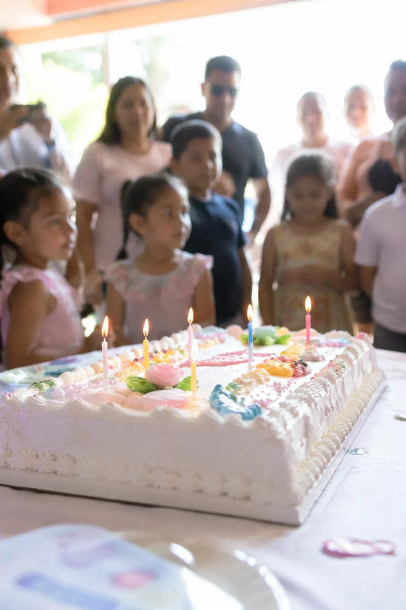 Lit Birthday Candles on Celebration Cake