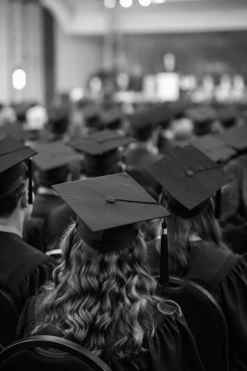 Graduation Caps in Auditorium Ceremony