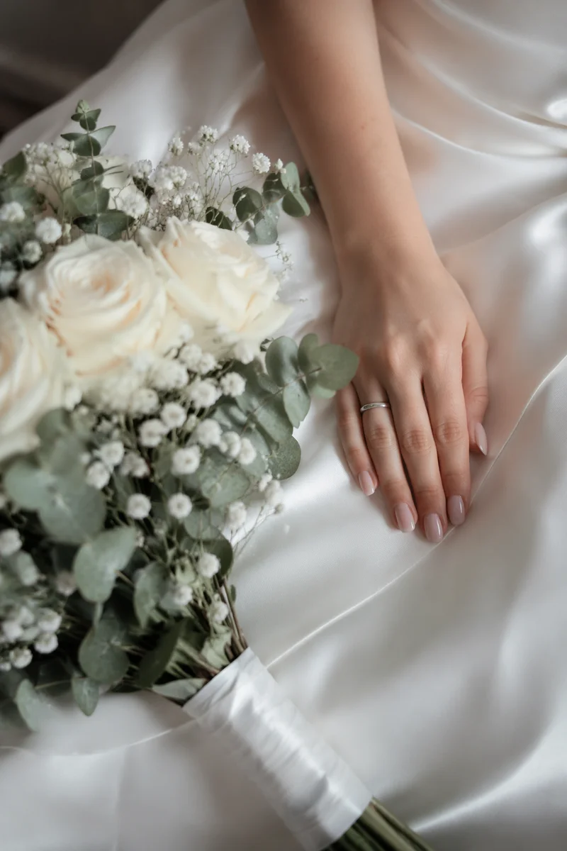 Bride Hands Beside White Wedding Bouquet