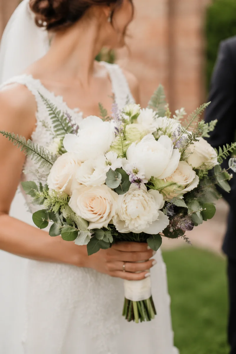 Elegant White Bridal Bouquet in Courtyard