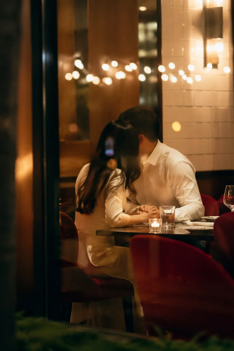 Romantic Anniversary Dinner Couple by Window