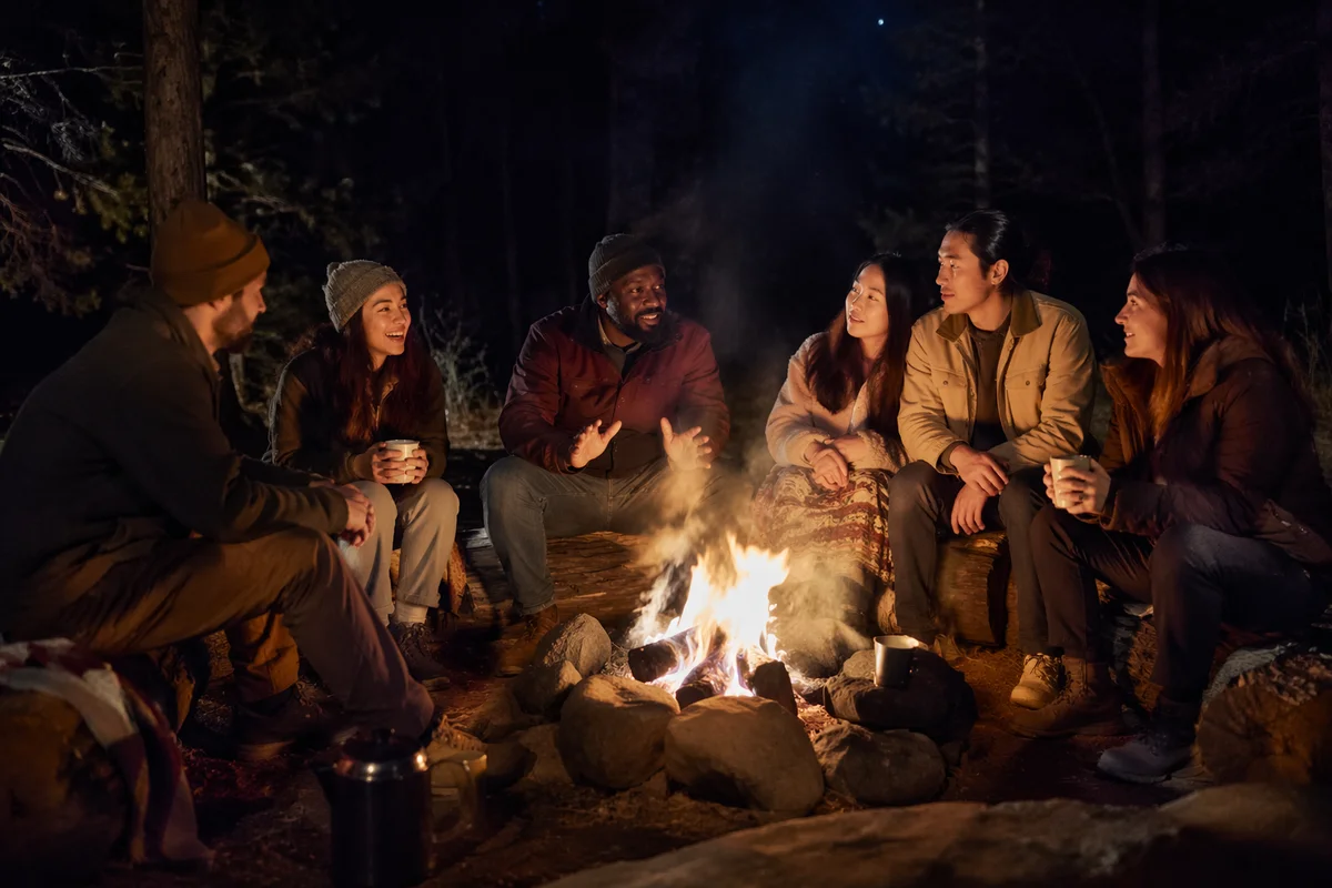 Friends Around Campfire in Forest Night