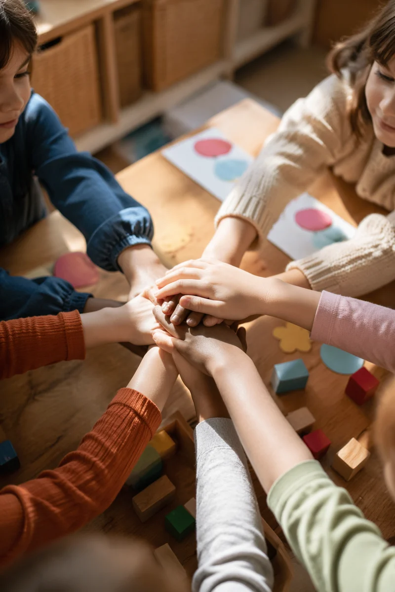 Children Hands Stacked in Friendship Circle