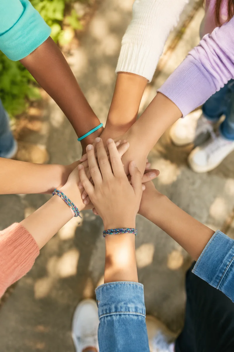 Children Teamwork Hands in Sunlit Fellowship