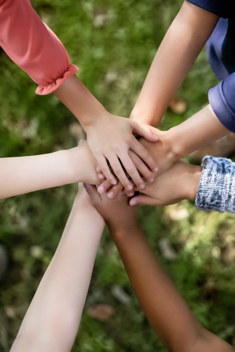 Children Hands Stacked in Cheerful Teamwork
