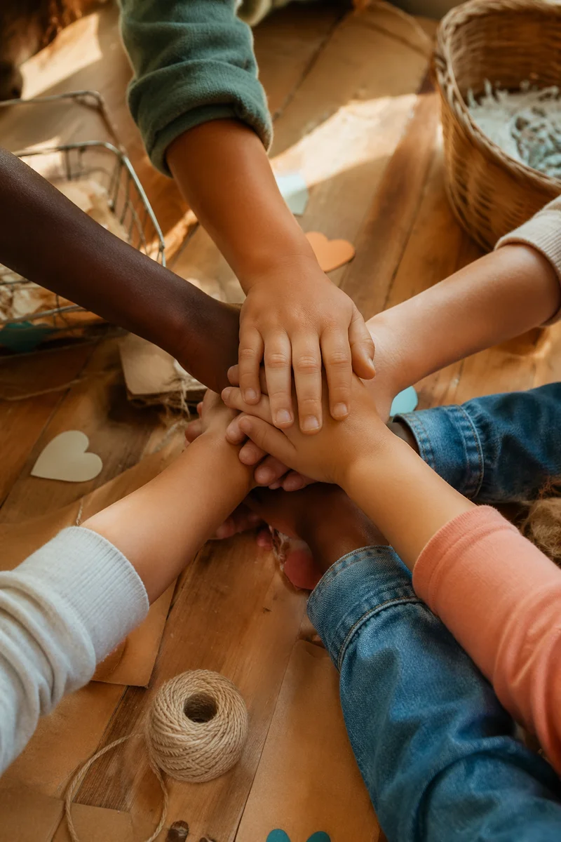 Children’s Hands Stacked for Community Service