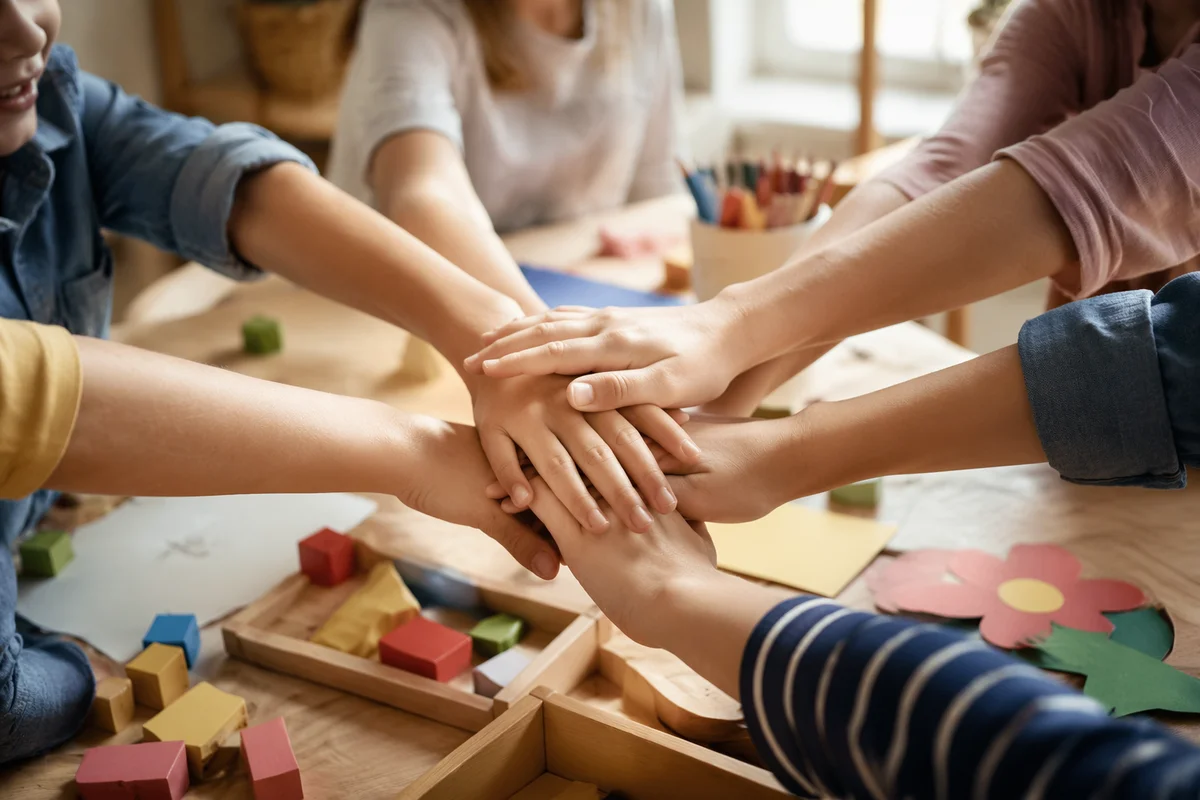 Children Hands Stacked in Friendship Circle