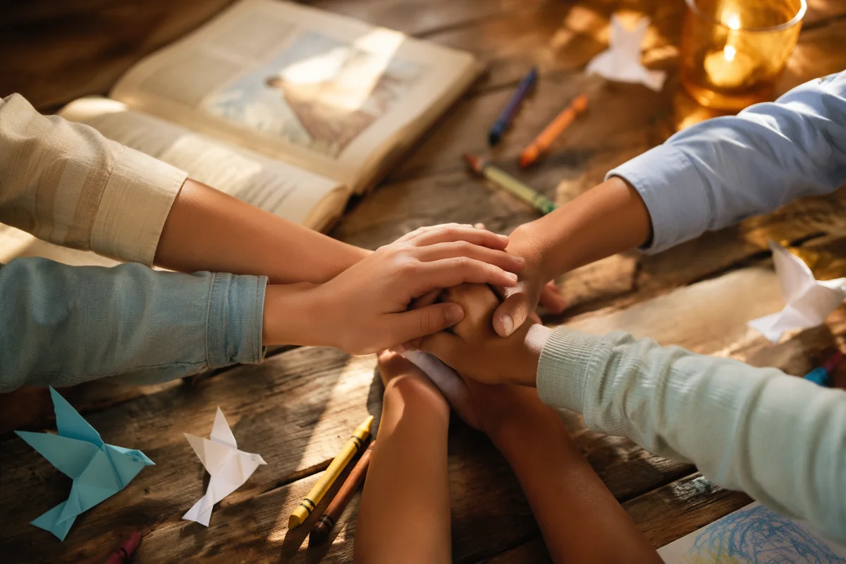 Children Stacking Hands After Sunday Craft
