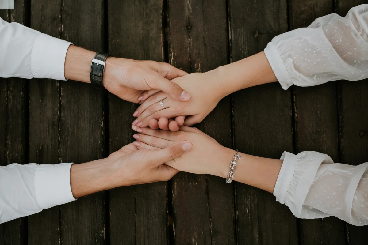 Couple Praying Together Holding Hands