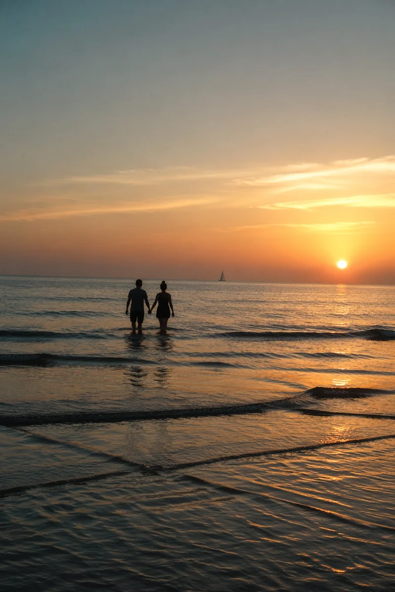 Couple Walking Hand in Hand at Sunset