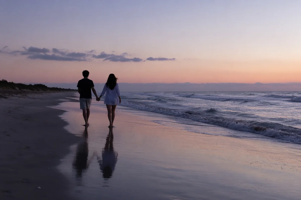 Couple Holding Hands on Sunset Beach