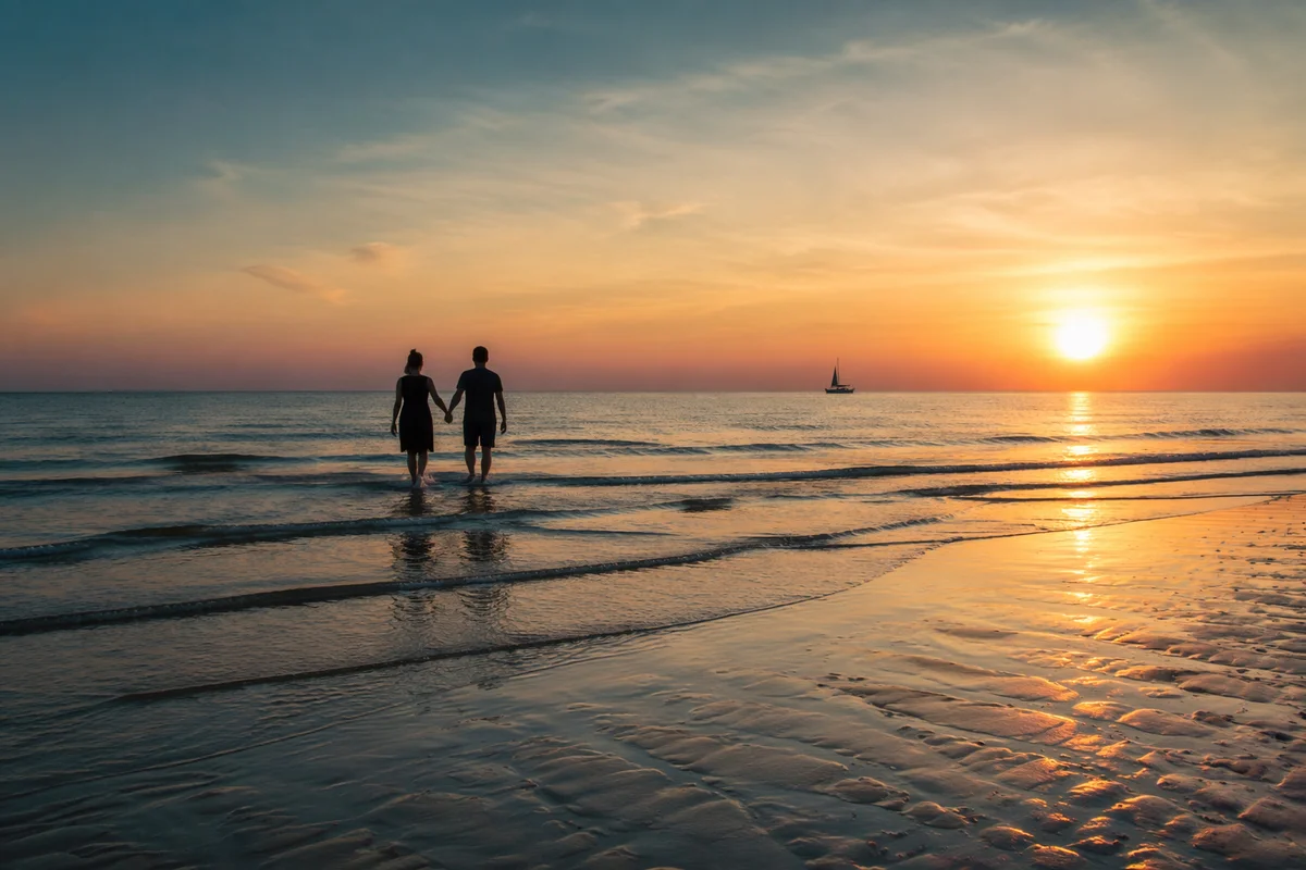Romantic Couple Silhouette Walking at Sunset Beach