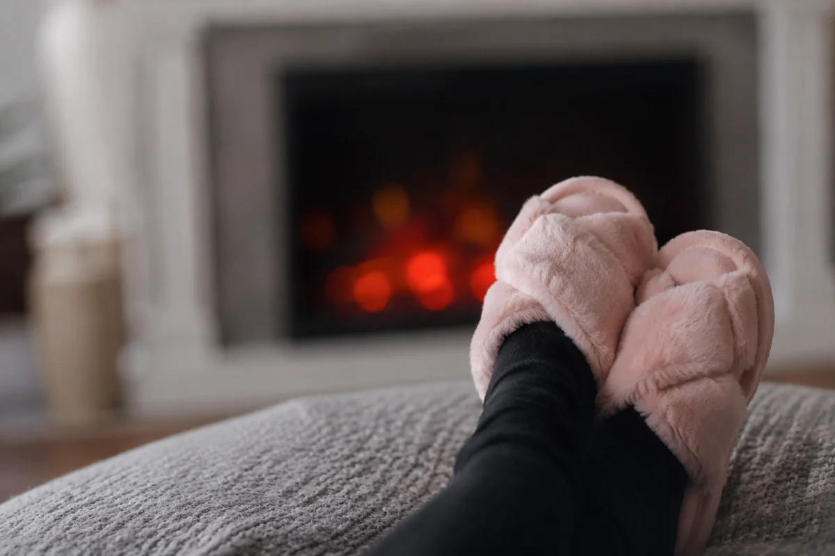 Cozy Fireplace Relaxation with Slippers and Socks