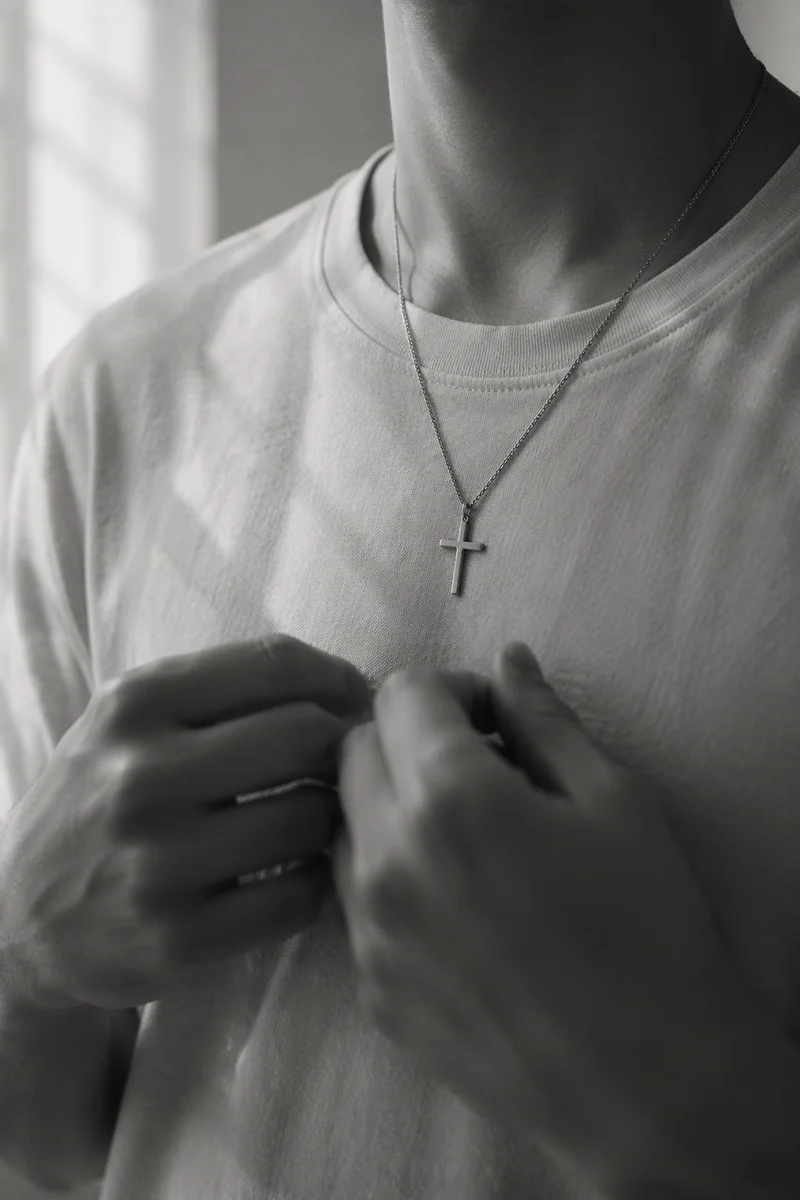 Silver Cross Pendant on Casual Shirt